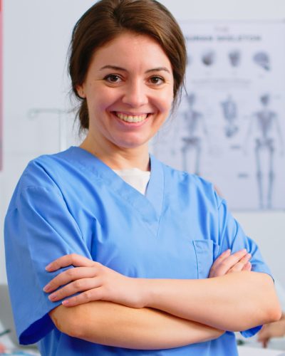 portrait-of-young-nurse-standing-in-front-of-camer-2022-02-03-10-43-47-utc.jpg